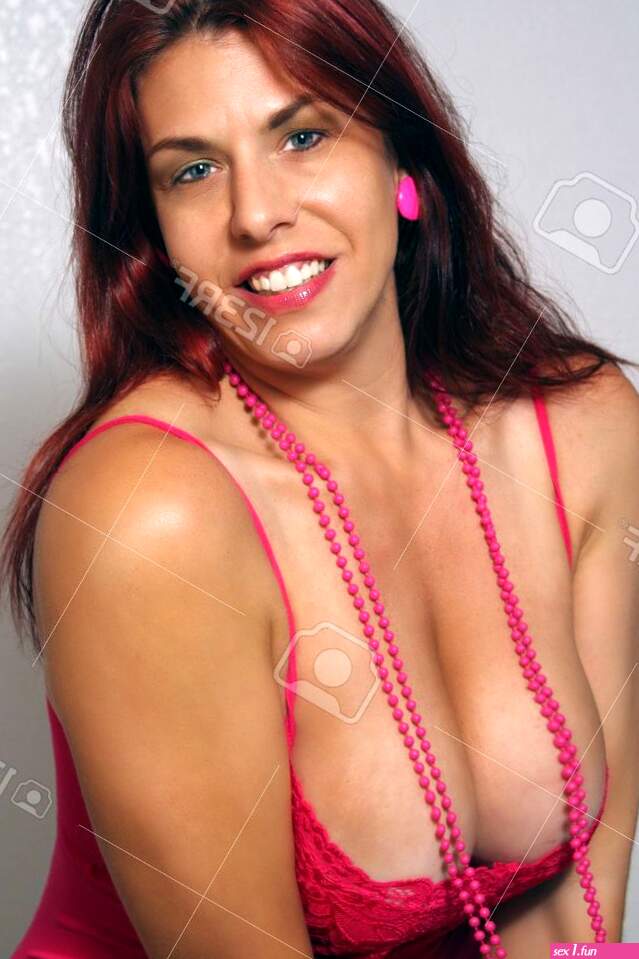 A Sexy Busty Redhead With A Bright Warm Smile. Stock Photo Picture and Royalty Free Image. Image 10811176.