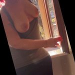 Exhibitionist wife cleaning windows topless. Sexy milf flashing boobs on window. Flashing neighbors